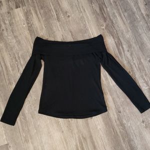 Off the shoulder, long sleeve, black top.